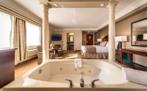 Luxury King Suite with Jetted Tub | Premium bedding, down comforters, in-room safe, individually decorated