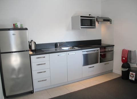 Two Bedroom Apartment | Private kitchen | Microwave, coffee/tea maker, electric kettle, toaster