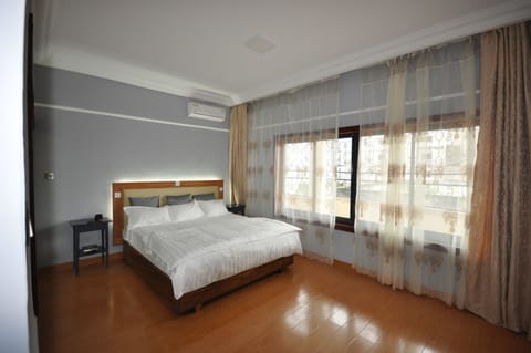 Deluxe Apartment, 2 Bedrooms, 2 Bathrooms | Minibar, in-room safe, blackout drapes, iron/ironing board