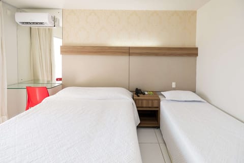 Deluxe Room | Minibar, blackout drapes, free cribs/infant beds, free WiFi