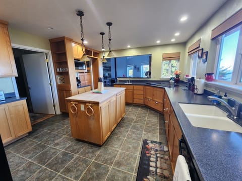 Spacious and accomidating kitchen with stunning ocean views.