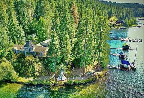 Gated lakefront estate includes your own private beach and boat dock.