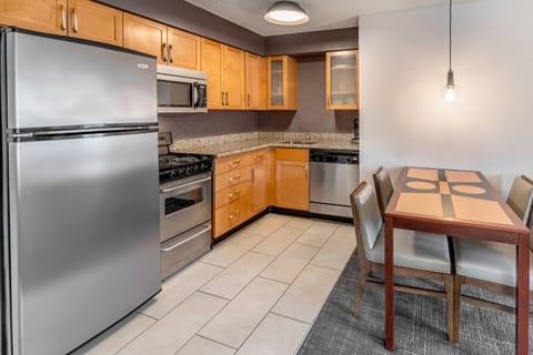 Suite, 2 Bedrooms | Private kitchen | Full-size fridge, microwave, stovetop, dishwasher