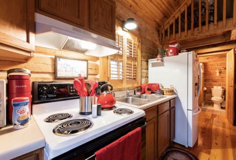 Kitchen has everything you need to cook meals. Plenty of plates and other items