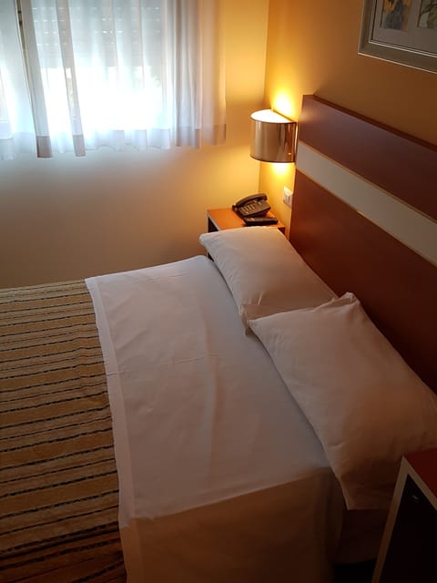 Economy Double Room with french bed | Frette Italian sheets, Select Comfort beds, desk, soundproofing