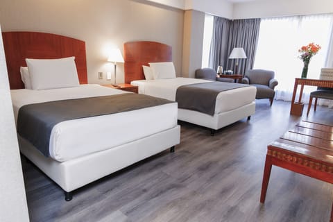 Hypo-allergenic bedding, down comforters, minibar, in-room safe