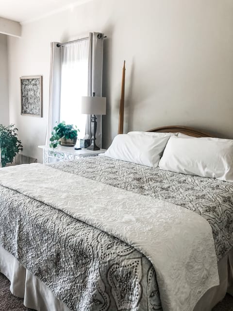 Comfortable king-size bed in master bedroom. 
