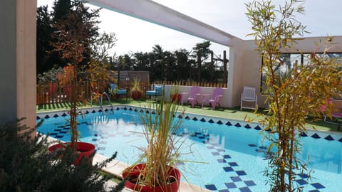 Seasonal outdoor pool, a heated pool, sun loungers