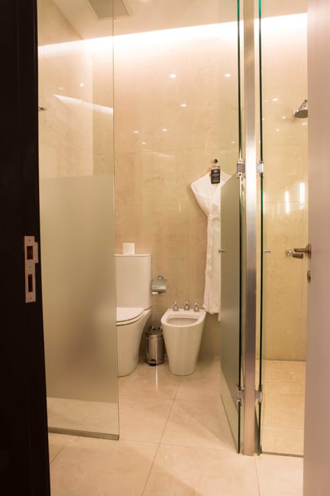 Suite, 1 King Bed, Corner | Bathroom | Designer toiletries, hair dryer, bidet, towels