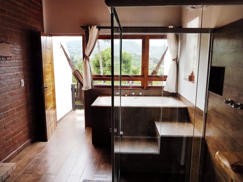 Deluxe Room | Bathroom | Separate tub and shower, deep soaking tub, rainfall showerhead