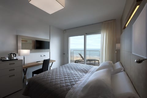 Deluxe Room, Sea Facing (Beach Access Included) | Minibar, in-room safe, desk, laptop workspace