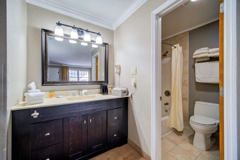 Standard Room, 1 King Bed, Second Floor | Bathroom | Combined shower/tub, rainfall showerhead, hair dryer, towels