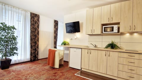 Luxury One-Bedroom Apartment with Balcony | Private kitchenette | Fridge, microwave, electric kettle, highchair