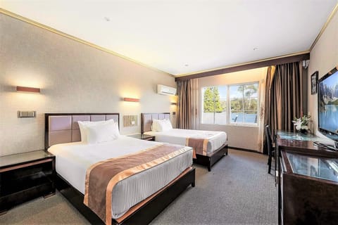Deluxe Hotel Room with Two Double Beds | Blackout drapes, soundproofing, iron/ironing board, free WiFi