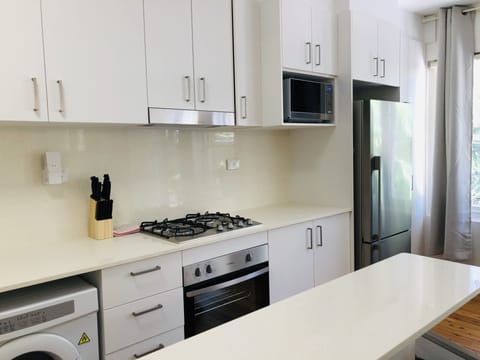 Comfort Apartment | Private kitchen | Full-size fridge, microwave, oven, stovetop