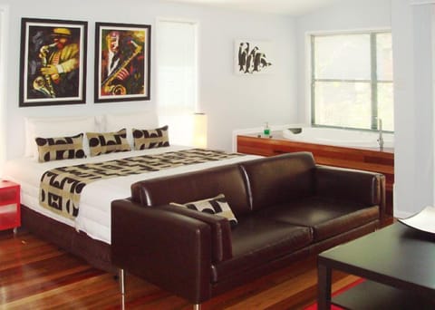 Deluxe Double Room | Living area | Flat-screen TV, fireplace, iPod dock