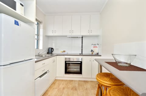 Two-Bedroom Apartment | Private kitchen | Full-size fridge, microwave, stovetop, coffee/tea maker