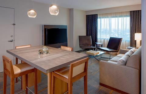 Executive Suite | Living area | 48-inch flat-screen TV with digital channels, TV, iPod dock