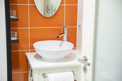 Shower, rainfall showerhead, designer toiletries, hair dryer