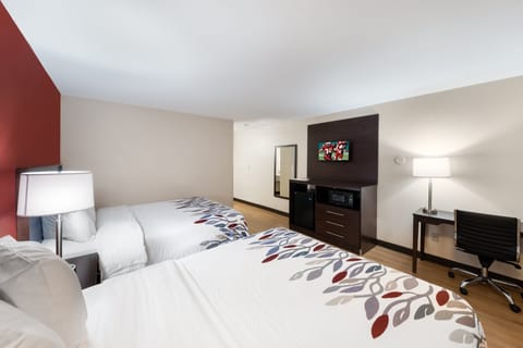 Desk, laptop workspace, iron/ironing board, free cribs/infant beds