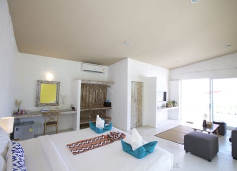 Suite, Beachfront | Minibar, in-room safe, individually decorated, individually furnished