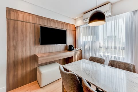 Suite Business Class Family | Living room | 42-inch LED TV with satellite channels