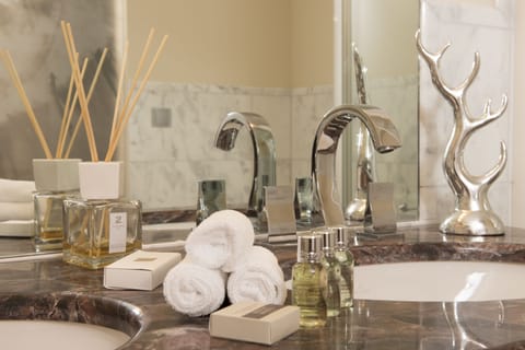 Designer toiletries, hair dryer, bathrobes, slippers