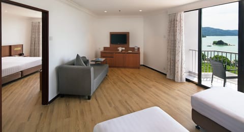 Family Suite, Partial Ocean View | Minibar, iron/ironing board, free WiFi, bed sheets