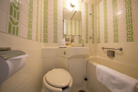 Combined shower/tub, free toiletries, hair dryer, slippers