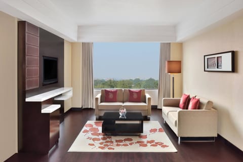 Suite, 1 King Bed, Non Smoking | Living room | 32-inch LCD TV with satellite channels, TV