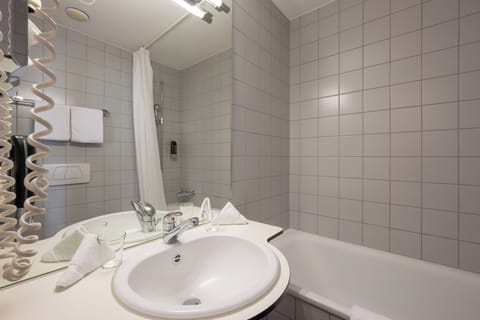 Combined shower/tub, hair dryer, towels, soap