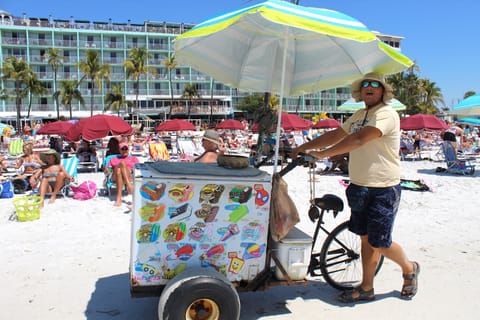 On the beach, white sand, beach towels, beach volleyball