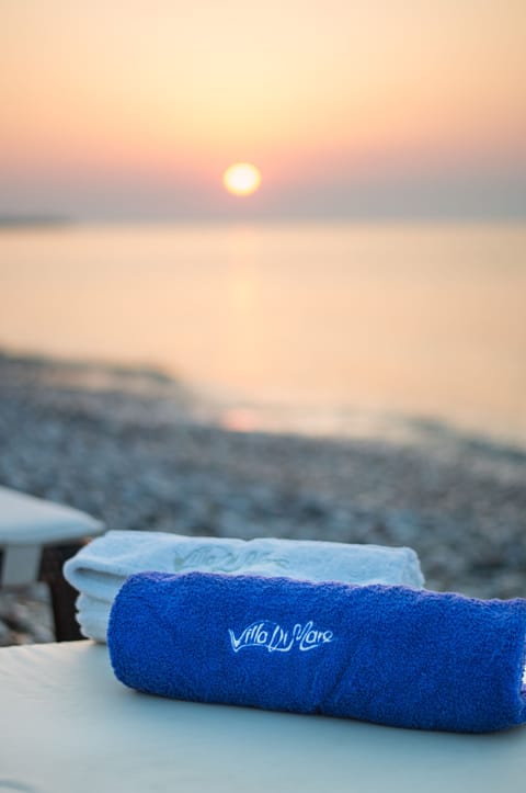 On the beach, sun loungers, beach umbrellas, beach towels