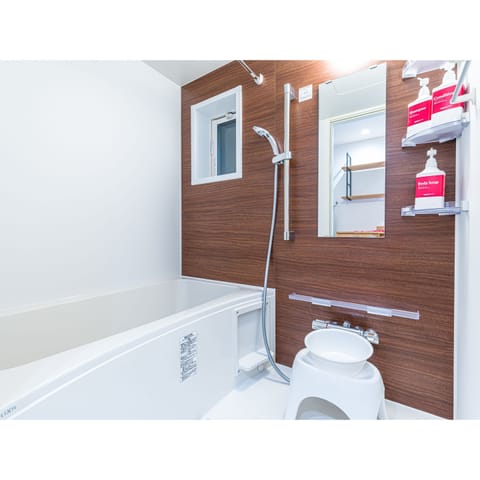 Separate tub and shower, free toiletries, hair dryer, slippers