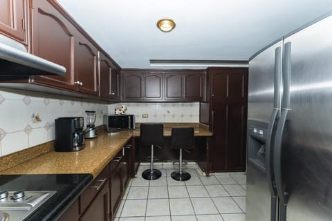 Traditional Apartment | Private kitchen | Full-size fridge, microwave, stovetop, coffee/tea maker