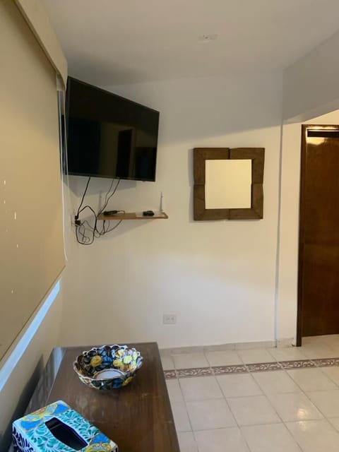 Basic Double Room | Living area | 40-inch Smart TV with cable channels, TV