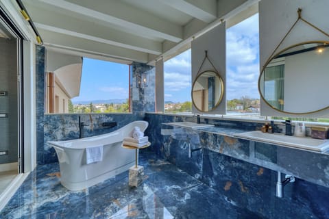 Presidential Suite, 2 Bedrooms, Jetted Tub, Lake View | Bathroom | Hair dryer, bathrobes, bidet, towels