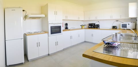 House (Addo Adventure House) | Private kitchen | Full-size fridge, microwave, oven, stovetop