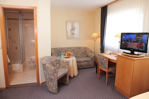 Superior Double Room | Living area | Flat-screen TV