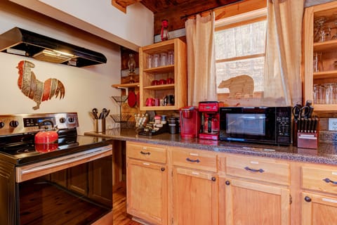 Various appliances, spices and coffee. Plenty of countertop space.
