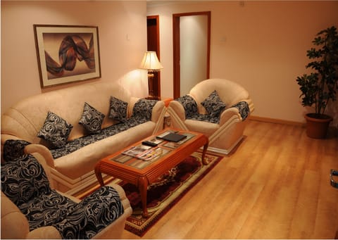 Executive Suite, 2 Bedrooms, Pool Access, City View | Living room | LCD TV