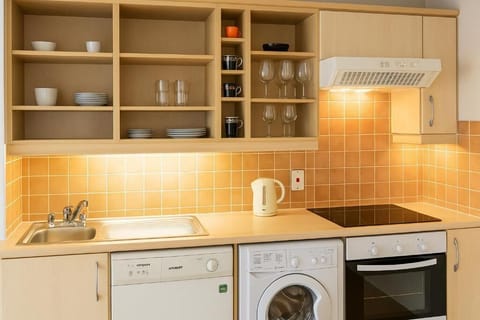 Comfort Apartment | Private kitchen | Coffee/tea maker, electric kettle, cookware/dishes/utensils