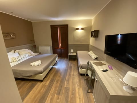 Triple Room, Balcony | Minibar, desk, iron/ironing board, free WiFi