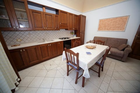 Apartment, 2 Bedrooms | Private kitchen | Full-size fridge, oven, stovetop, coffee/tea maker