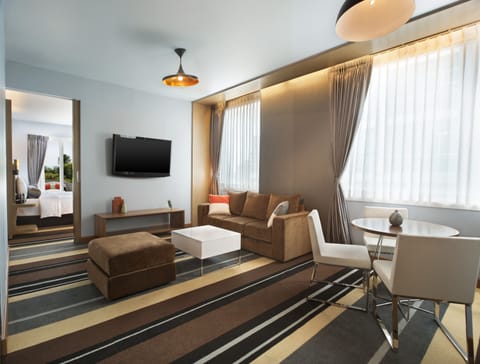 Suite, 1 Bedroom, City View (Savvy Suite) | Living area | 42-inch TV with satellite channels