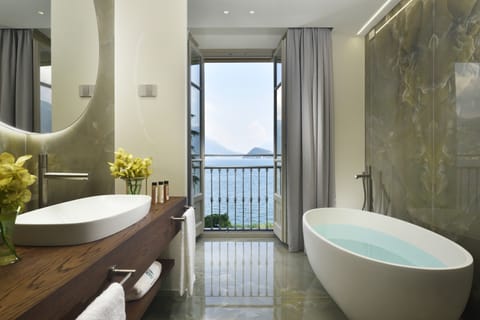 Exclusive Suite, 1 Bedroom, Lake View | Bathroom | Shower, free toiletries, hair dryer, bathrobes