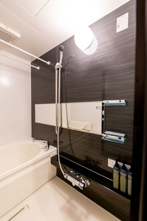 Separate tub and shower, free toiletries, hair dryer, slippers