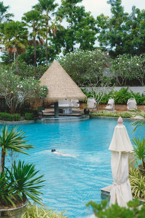 Outdoor pool, open 6:00 AM to 6:00 PM, pool umbrellas, sun loungers