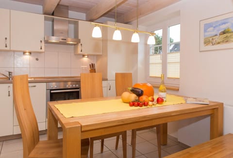 Kitchen & dining table in apartment Sonnendeck