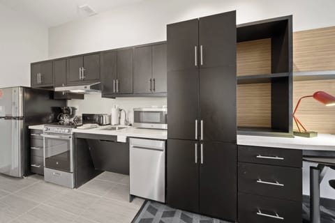 Suite, 1 Bedroom | Private kitchen | Full-size fridge, microwave, stovetop, dishwasher